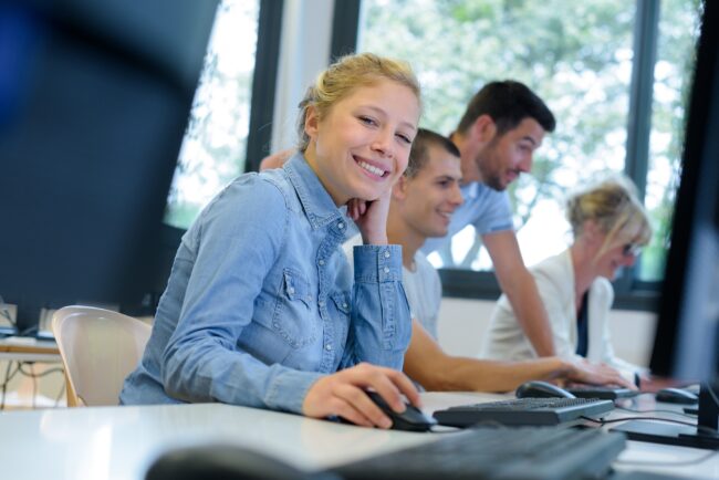 portrait of young woman in computer studies class